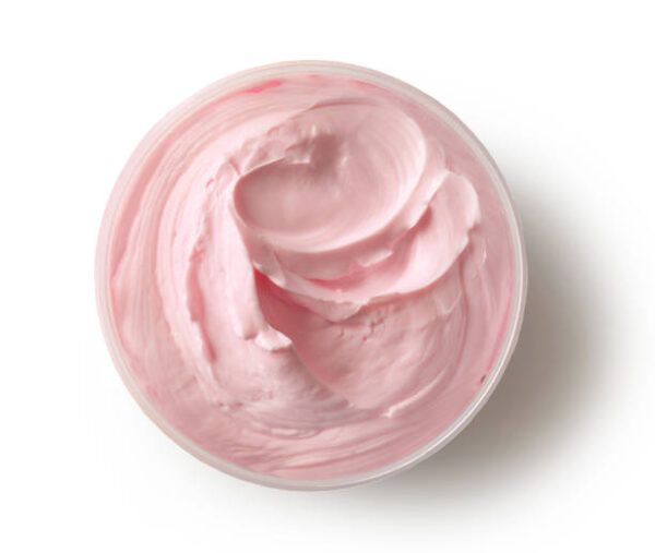 Jar of pink cosmetic cream body butter isolated on white background, top view